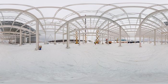 Full spherical 360 by 180 degree panorama of winter construction site in cloudy weather. Equirectangular projection of sphere. Can be used in virtual reality backgrounds.