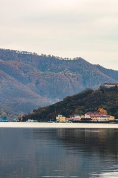 View of Danube river and Orsova city vegetation and buildings, waterfront view. Orsova, Romania, 2021