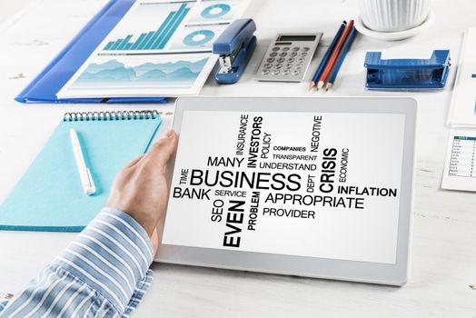 close-up, male hands with tablet. Businessman working at the table in office