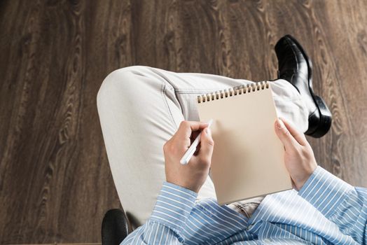 close-up of male hands with notepad, copy space