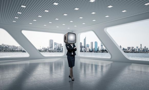 Business woman in suit with an old TV instead of head keeping arms crossed while standing inside office building. 3D rendering.