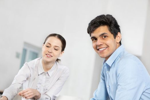 portrait of a young man at a business meeting. concept of team work