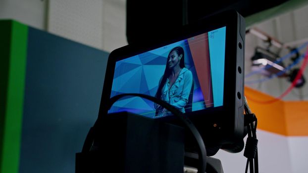 the girl TV presenter is broadcasting live in the studio, communicating with the girl as a guest