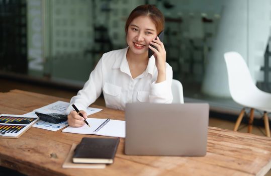 data analysis, plan, marketing, accounting, audit, asian business woman holding smart phone of planning marketing use statistical data sheet and computer to present marketing plan project at meeting