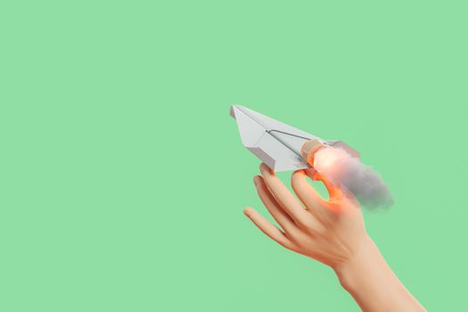 cartoon hand launching a propelled paper airplane. concept of impulse, thrust, education and startup. 3d rendering