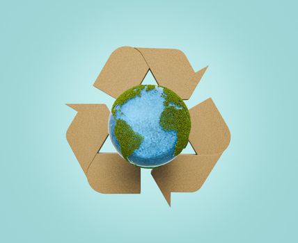 planet earth with vegetation and wood recycling symbol on the back. concept of sustainable resources and earth day. 3d rendering