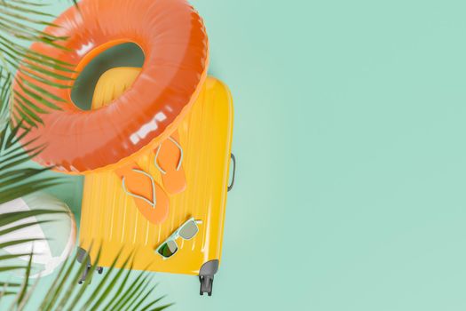 suitcase with summer travel accessories and palm tree leaves on top. space for text. concept of summer, vacations, travel, destinations, beach and swimming pool. 3d rendering