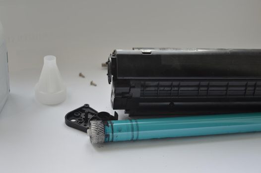 Charging the laser printer cartridge with toner the powder