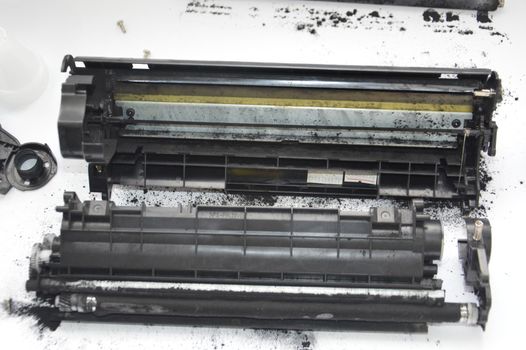 Charging the laser printer cartridge with toner the powder