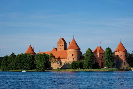 Trakai Island Castle in lake Galve with boats in summer day, Lithuania. Trakai Castle is one of major tourist attractions of Lituania