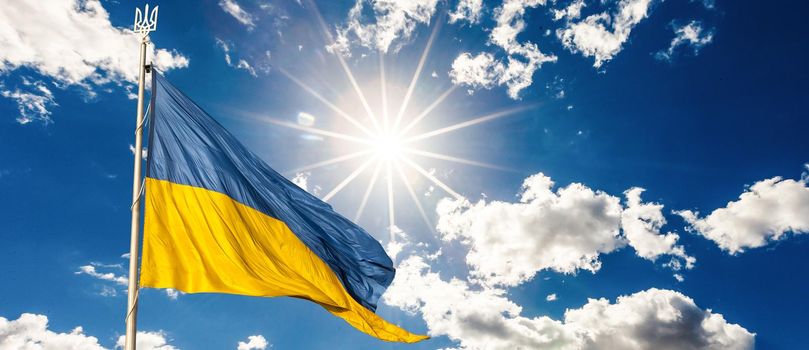 Ukrainian flag on blue sky backgroud.