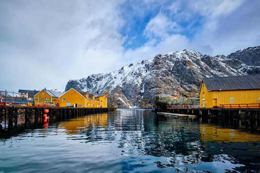 Nusfjord authentic fishing village in winter with red rorbu houses. Lofoten islands, Norway