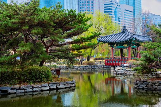 Yeouido Park public park pond with pavilion summerhouse in Seoul, Korea
