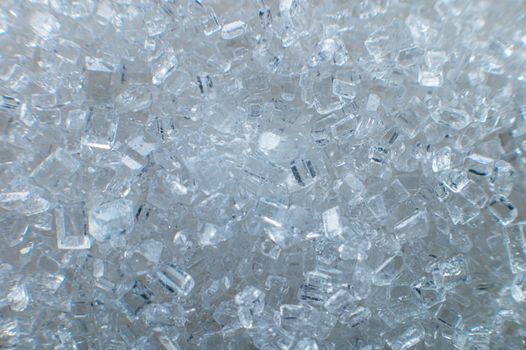 Sugar crystals. Great zoom, extreme macro. For illustration, texturing and collage. Sugar in shallow depth of field.