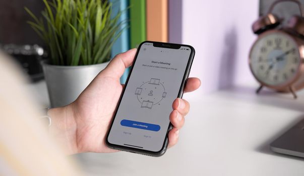 CHIANG MAI, THAILAND JULY 3 2020 : ZOOM application on applie iphone smartphone for internet meetings for remote workers or online education.