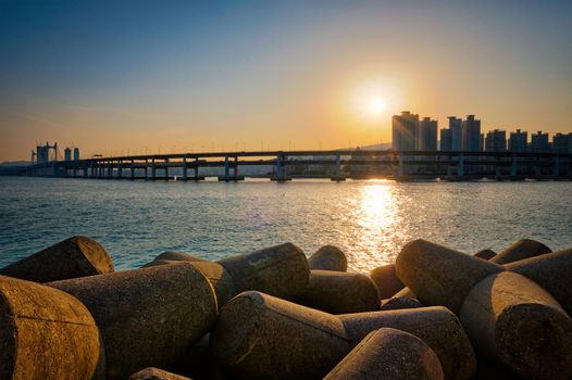 Gwangan bridge on sunset and skyscrapers. Busan, South Korea