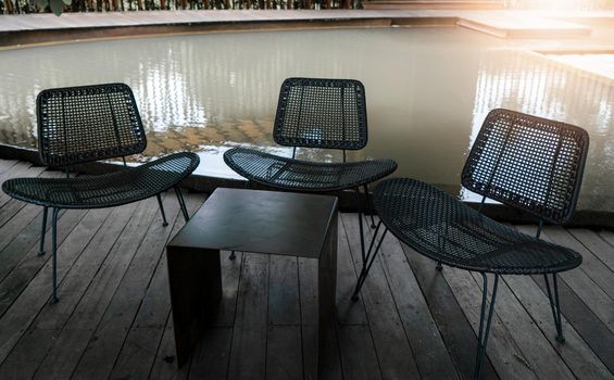 Steel table and three chairs for relaxing or meeting outside