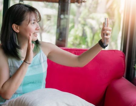 Asia woman using smartphone for video call with friend