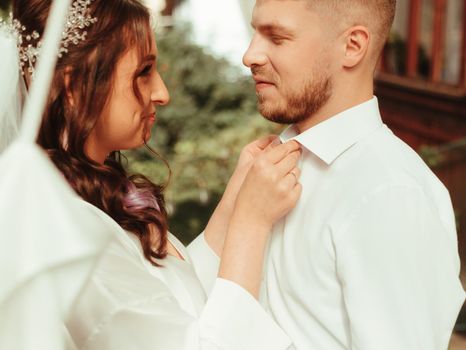 Bride and groom at the garden wearing wedding cloth grain effect sunny day