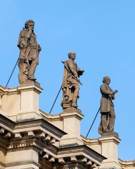 Statues on a roof of Concert and gallery center Rudolfinum, Prague, Czech Republic