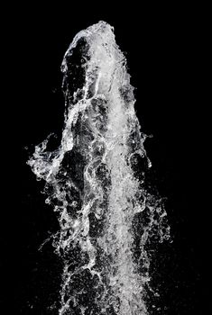 Splash of pouring water isolated over black background