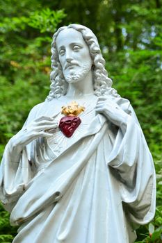 Statue of Jesus with a red heart