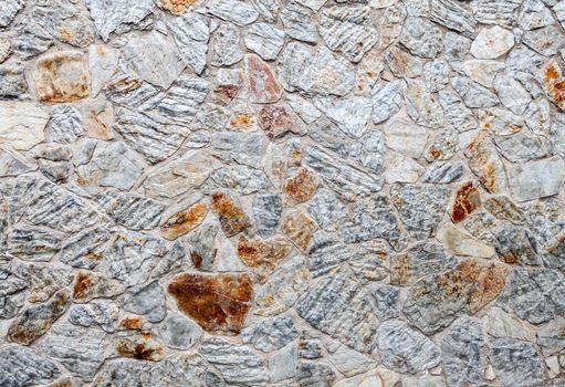 Close up of old weathered stone wall for background