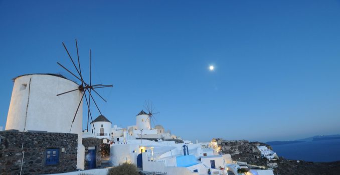 Astonishing evening view of Santorini island. Magnificent summer sunset on famous Greek resort Oia, Greece, Europe. Fantastic seascape of Mediterranena sea.