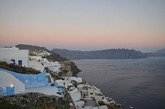 Great evening view of Santorini island. Picturesque spring sunset on the famous Greek resort Fira, Greece, Europe. Traveling concept background. Artistic style post processed photo.
