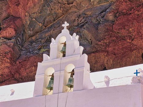 Greek Orthodox Church in Thira on Santorini Island with Line of Cruise Ships on Background