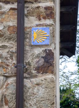 Road sign of Camino de Santiago, pilgrimage route to the Cathedral of Santiago de Compostela