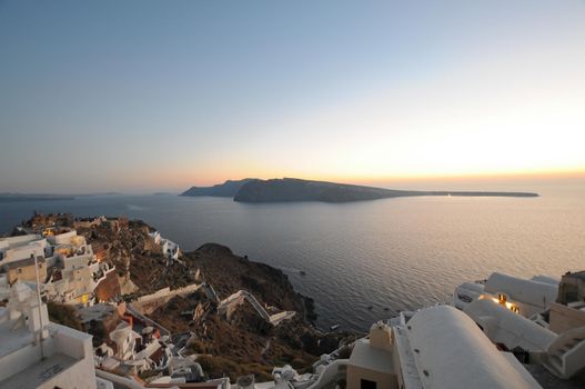 Stunning morning panorama of Santorini island. Splendid spring sunrise on famous Greek resort Oia, Greece, Europe. Traveling concept background. Artistic style post processed photo.