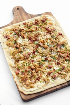 Flammkuchen tarte flambee traditional german alsace specialty pizza with onion and bacon
