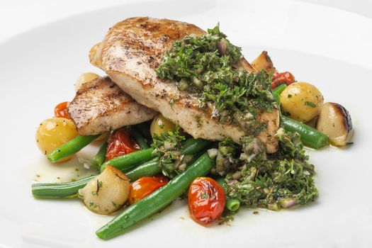 grilled chicken breast with argentina chimichurri sauce and vegetables meal in buenos aires gourmet restaurant
