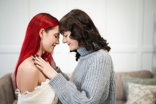 Young Caucasian women hugging tenderly. Same-sex relationships