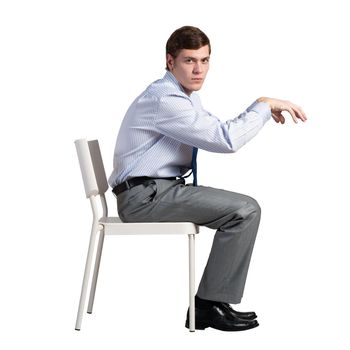 businessman sits on a chair, plays an imaginary piano