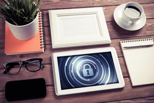 Business workplace with office stuff and tablet with padlock icons on screen