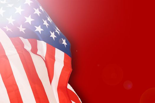 Fragment of american flag on empty red concrete background. Independence day backdrop.
