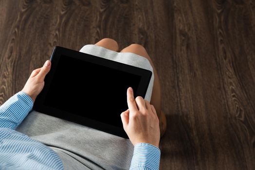 close-up of female hands with a computer tablet