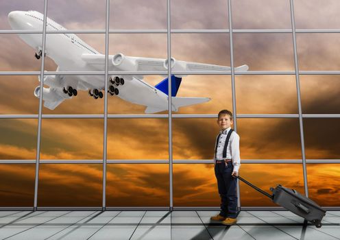 Travel tourist standing with luggage watching sunset at airport window. Unrecognizable woman looking at lounge looking at airplanes while waiting at boarding gate before departure. Travel lifestyle. High quality photo