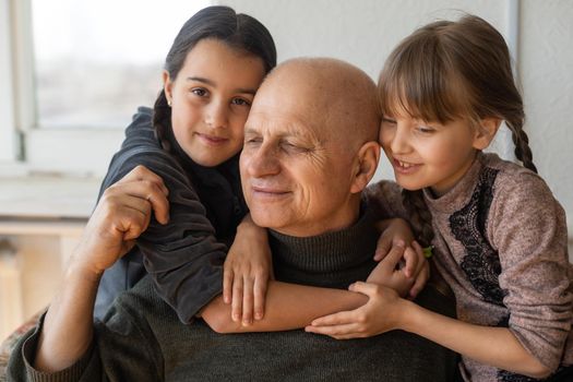 Family bonding. grandfather and child holding hands together, closeup view. Panorama.