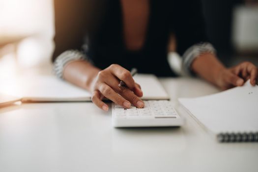 Close up view of bookkeeper or financial inspector hands making report, calculating or checking balance. Home finances, investment, economy, saving money or insurance concept.