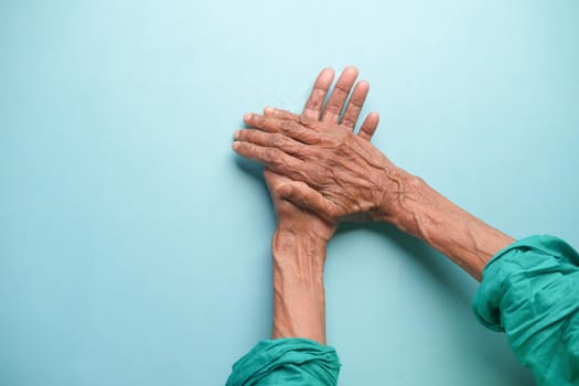 top view of hands of a elderly person .