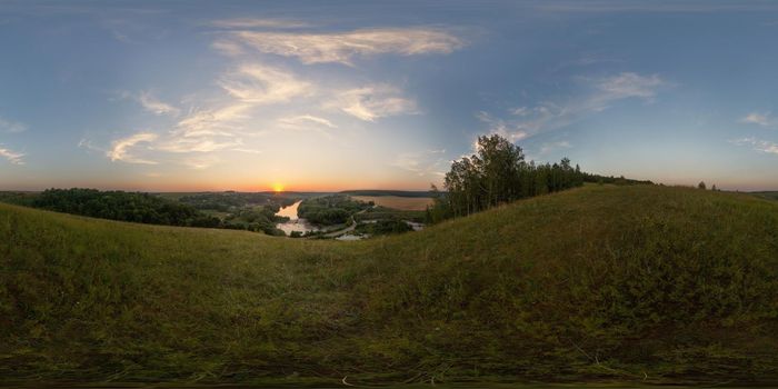 Spherical panorama from hill at summer sunset. Full view on 360 degree wide and 180 degree high.