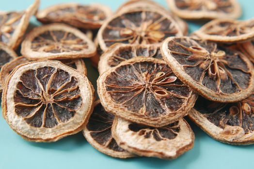 close up of dry lemon in a bow on table .
