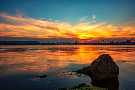 Amazing twilight colors of clouds and reflection on the water