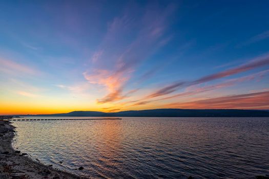 Stunning vast seascape at sunrise from the seashore. 