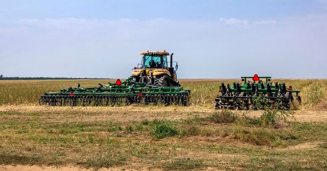 The machinery ready to prepare the ground for sowing and cultivation. Agriculture and agronomy concept.