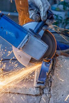 Close Up of Grinding Work with Smooths Equipment for Steel Metal, Iron, Sparks. Factory  Indoor.