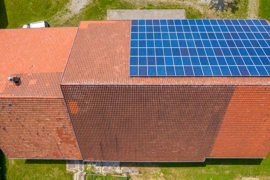 solar panels on the roof of a house. Aerial view from drone 